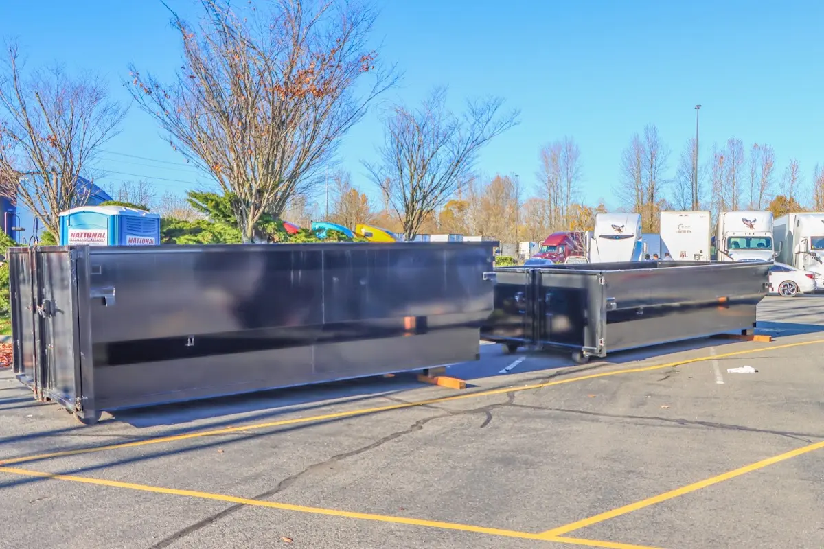 Professional dumpster rental service with roll-off container on residential driveway in Azalea Park